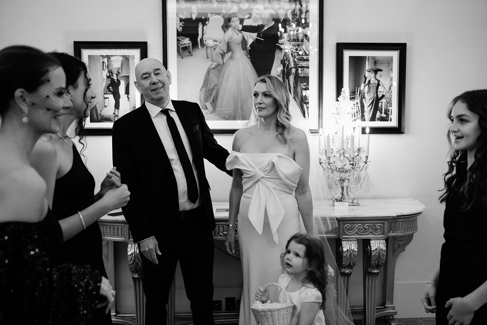 Bride laughing with family members during wedding preparations at Hôtel Plaza Athénée